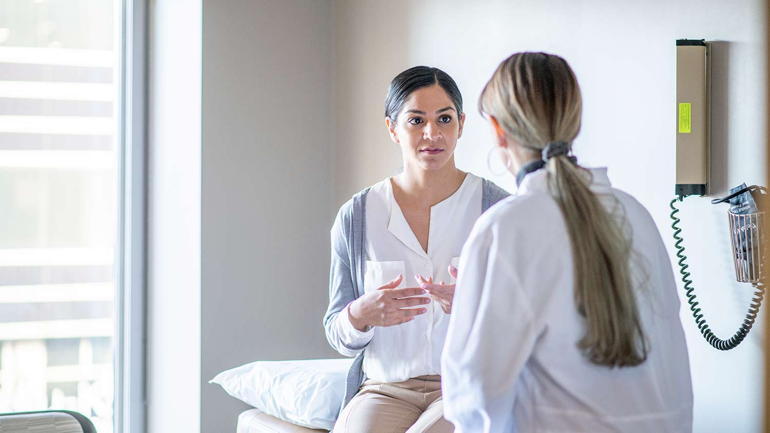 Woman speaking with doctor