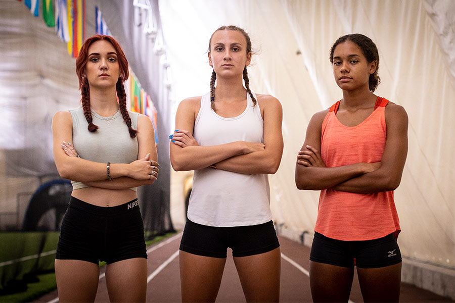 Track athletes Selina Soule, Chelsea Mitchell, and Alanna Smith are seen at an indoor track