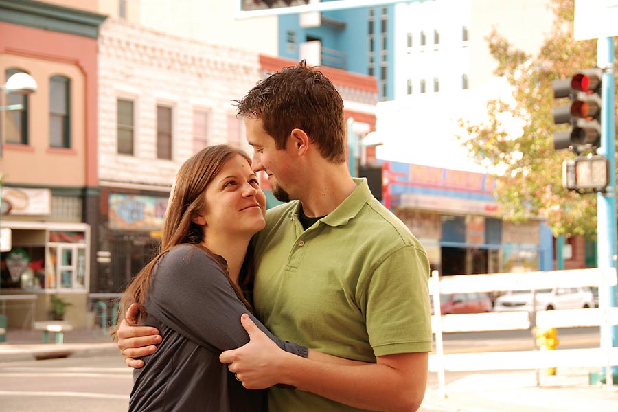 Jonathan and Elaine Huguenin share a hug